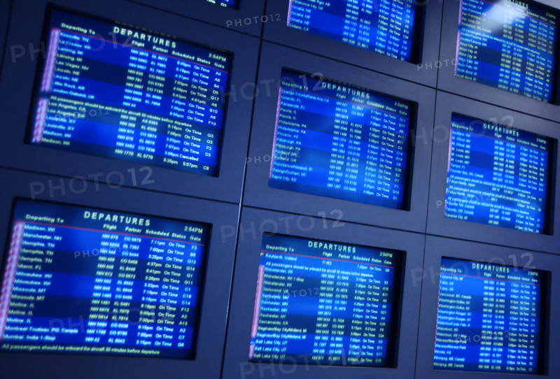 Airport arrival and departure information monitors.