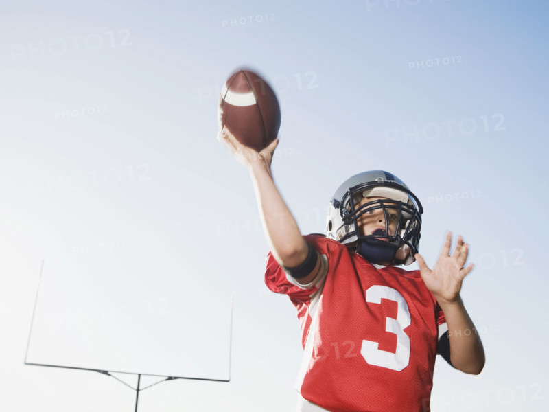 Quarterback throwing football. Date: 2008