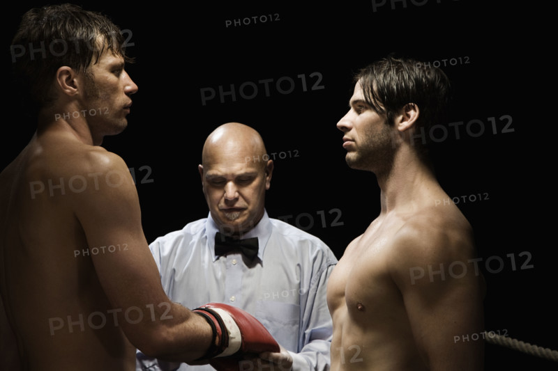 Referee checking boxer’s gloves. Date: 2008
