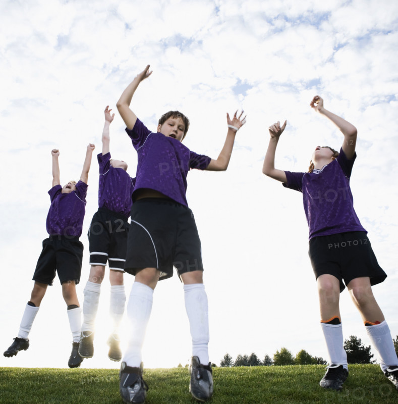 Boys soccer team celebrating on field. Date : 2008
