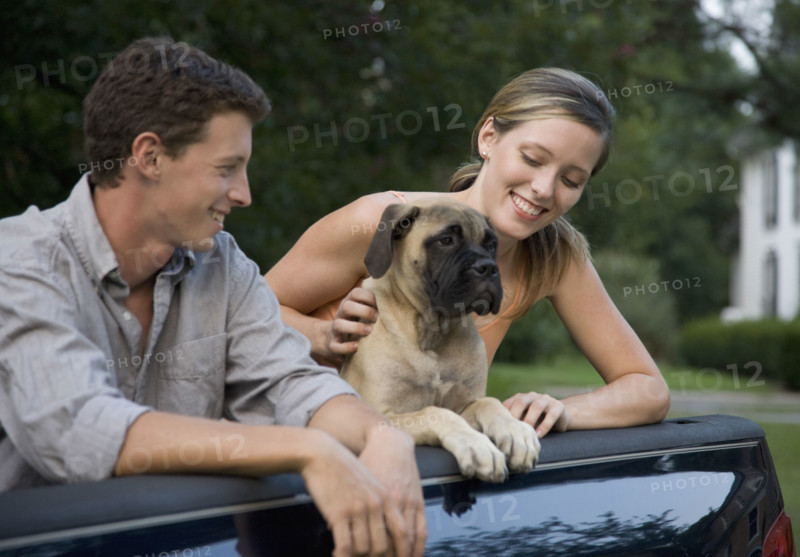 Couple and dog in back of truck. Date : 2008