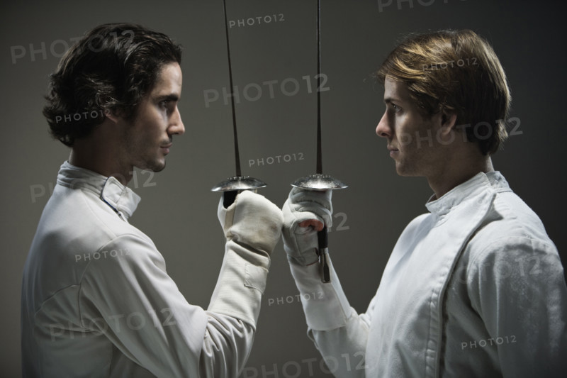 Fencers facing off with fencing foils. Date : 2008