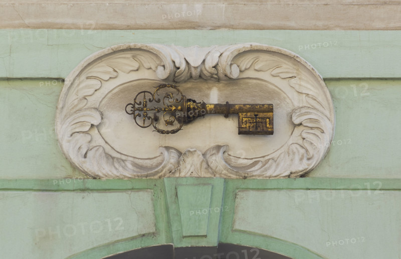Gold key plaque to identify house, Prague.