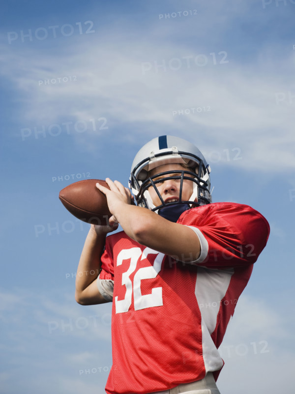 Quarterback preparing to throw football. Date: 2008