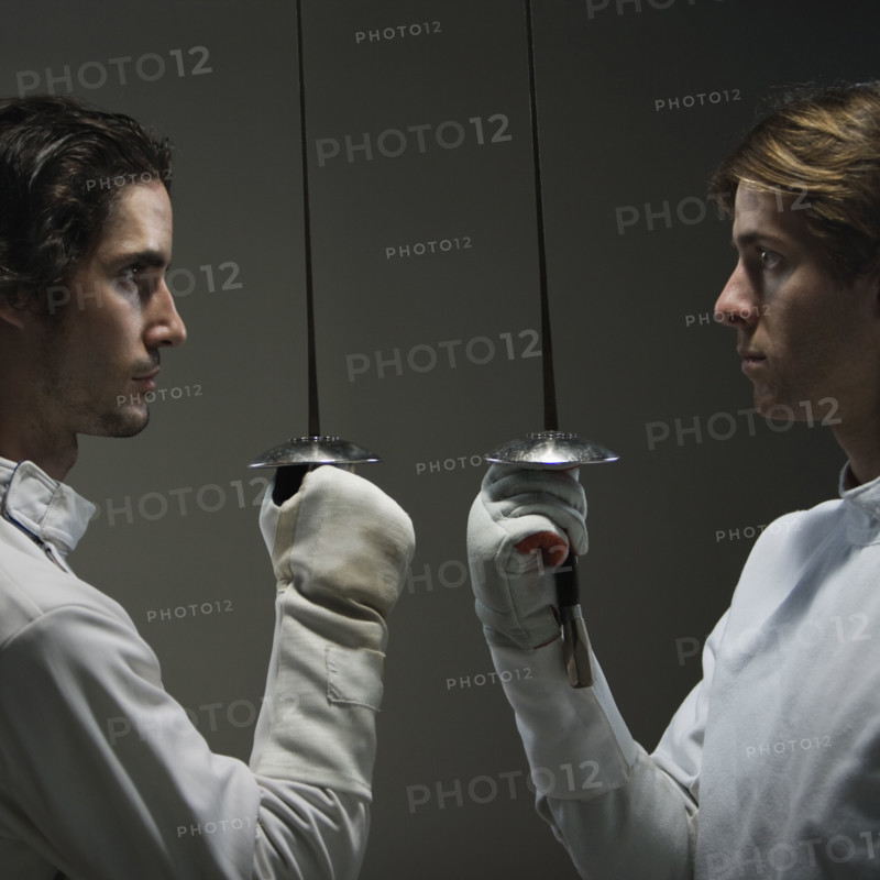 Fencers facing off with fencing foils. Date : 2008