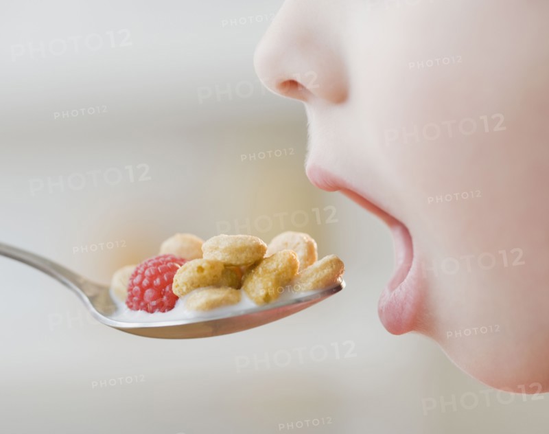 Boy eating cereal.
