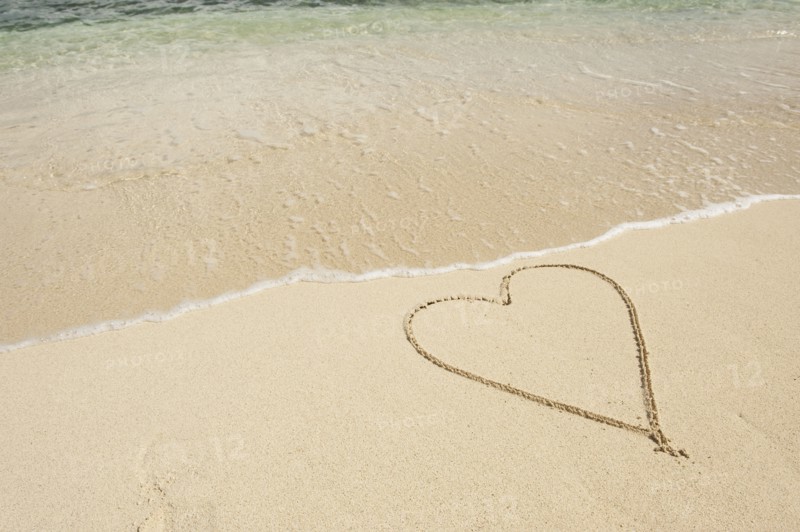 Heart drawn in sand.