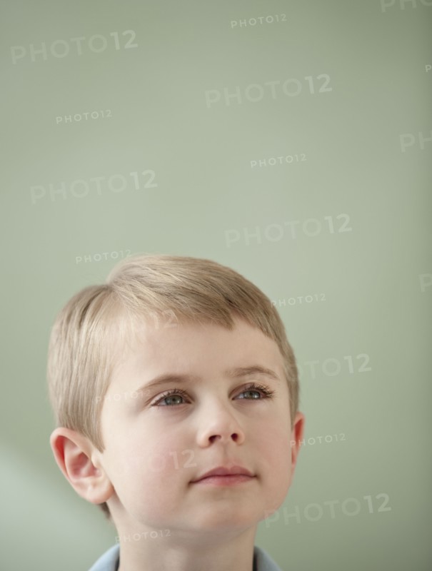 Portrait of boy looking up.