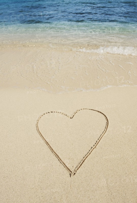 Heart drawn in sand.
