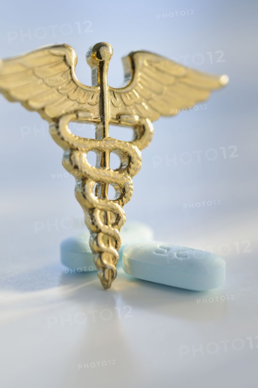 Prescription medicine and caduceus.