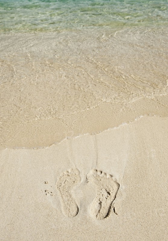 Footprints in sand.