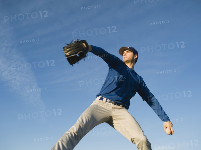 Baseball player throwing ball.