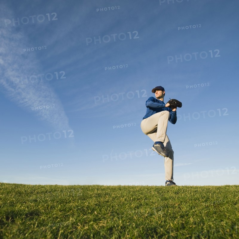 Baseball player throwing ball.