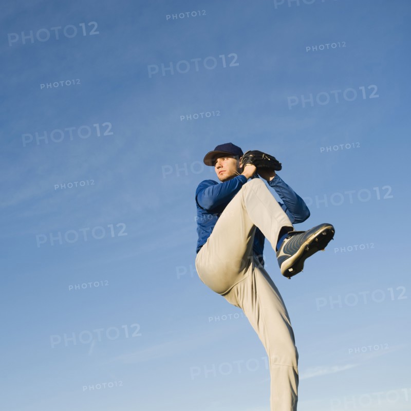 Baseball player throwing ball.