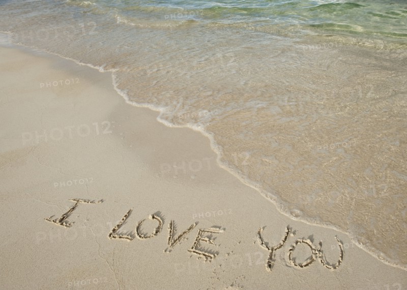 I love you message written in sand.