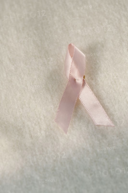 Close up of breast cancer ribbon.