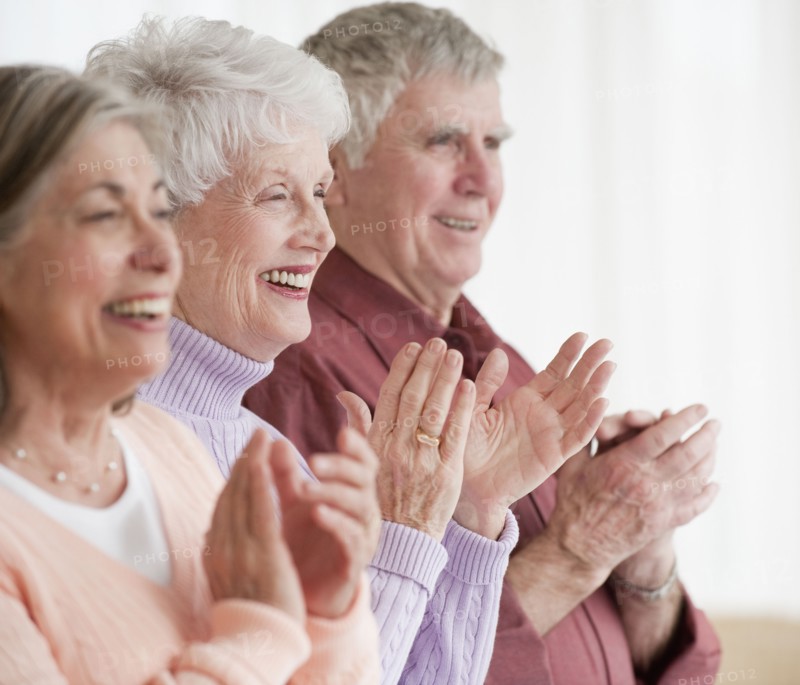 Senior adults clapping.
