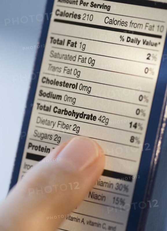 Man reading nutrition information.
