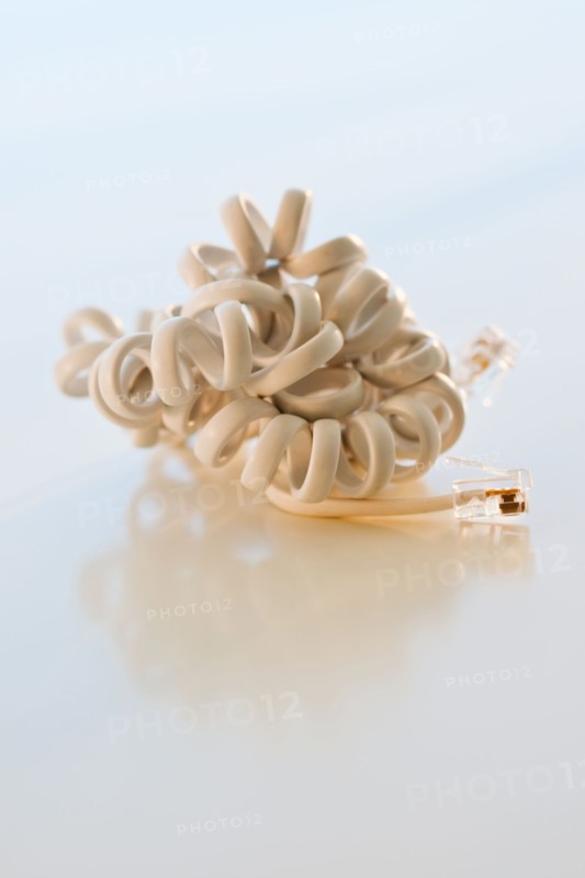 Studio shot of disconnected phone cord.
