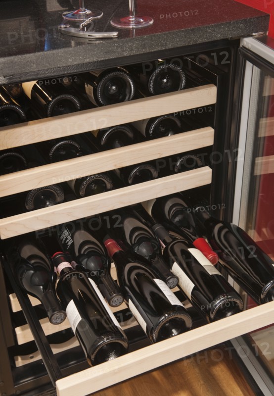 Wine bottles in wine cooler.