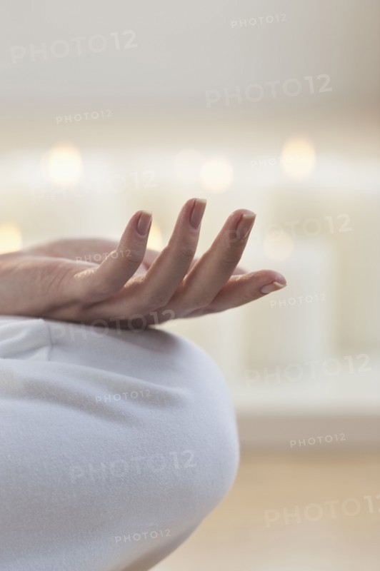 Close-up of woman's hand knee.