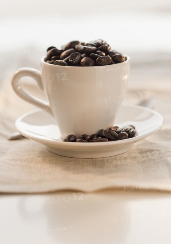 Coffee beans in cup.