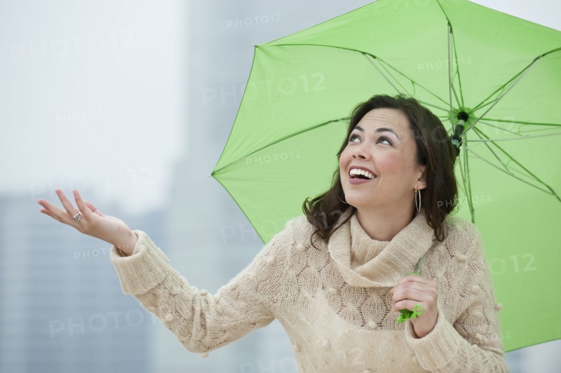 A woman outdoors in the rain.