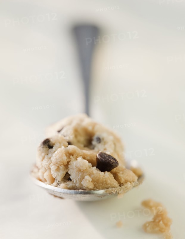 Chocolate chip cookie dough on a spoon