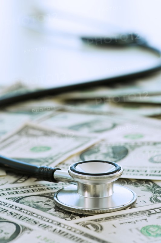 Stethoscope on bank notes