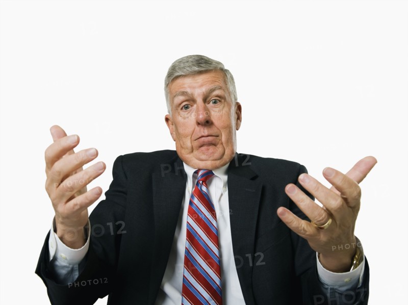 A businessman shrugging