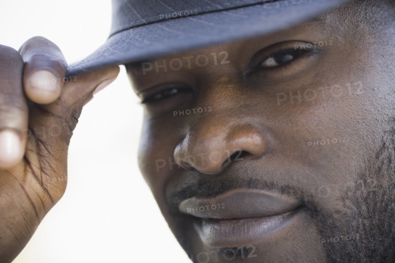 A man outdoors wearing a hat