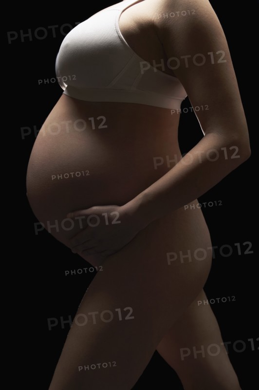 Pregnant woman holding belly