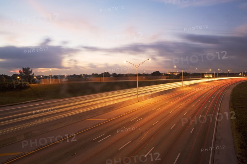 A road with tail light trails