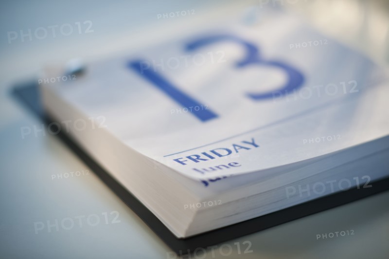 A calender showing Friday the thirteenth.