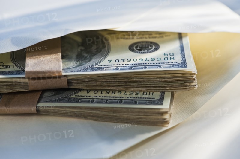 Hundred dollar bills in an envelope