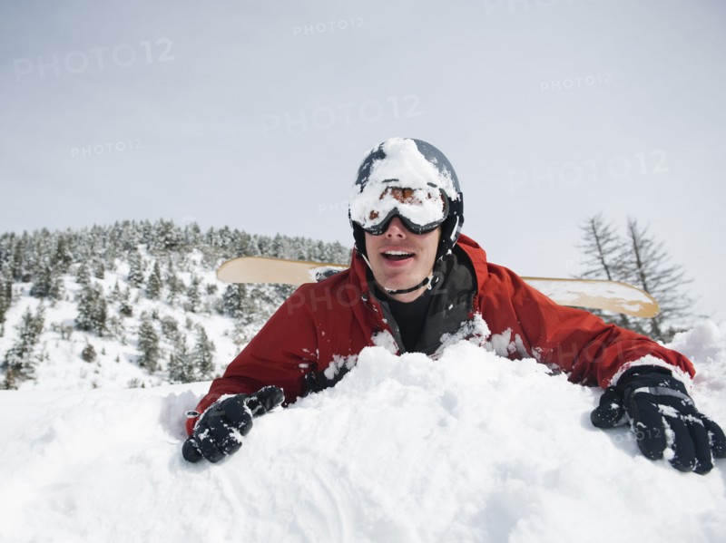 A snowboarder falling