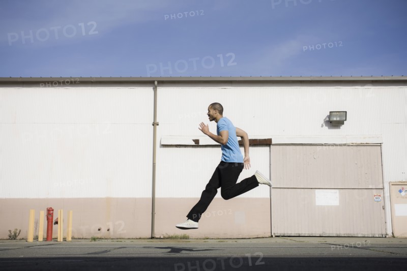 A man jumping on a road