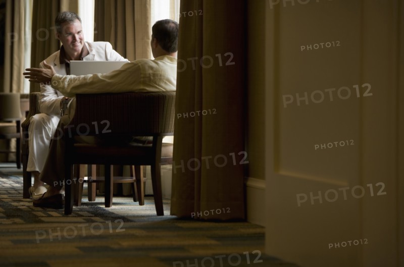 Two business people in a lobby