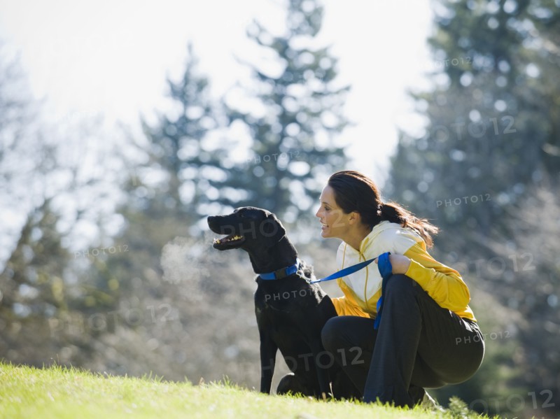 A woman with a dog outdoors