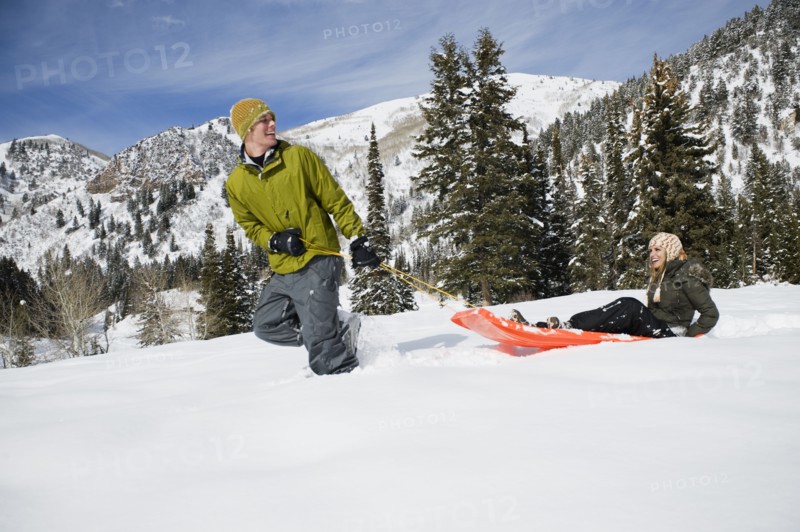 A couple sledding