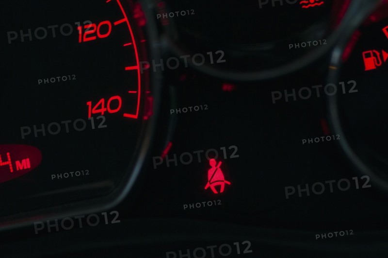 The seat belt warning on the dashboard of a car
