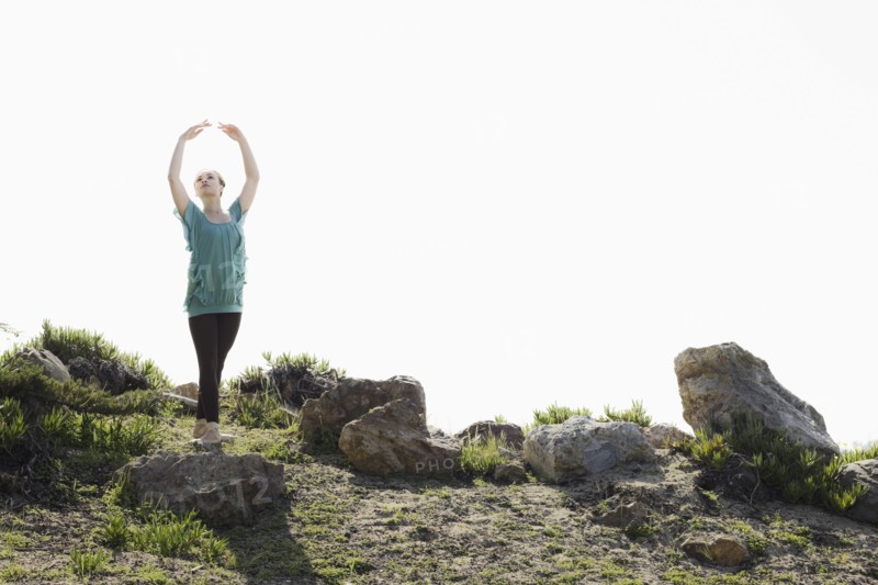 A woman dancing outdoors