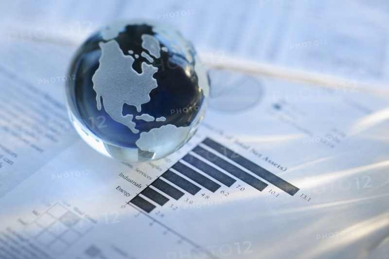 A globe on business papers.