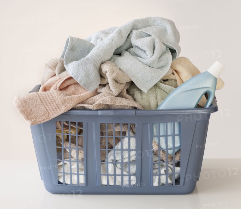 A laundry basket full of towels.