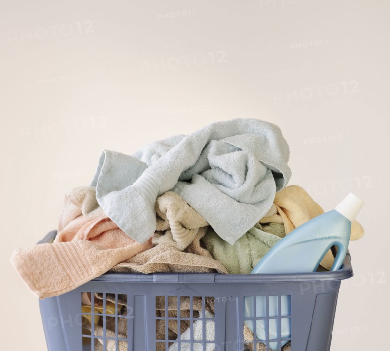 A laundry basket full of towels.