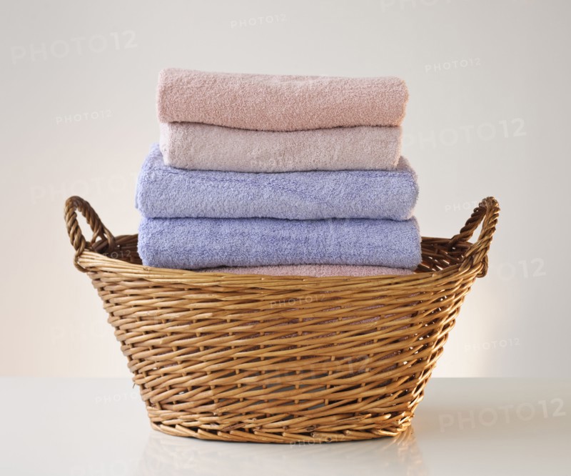 A laundry basket full of towels.