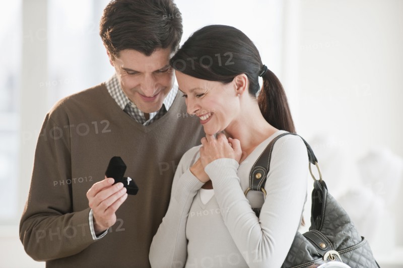 A couple looking at engagement rings.