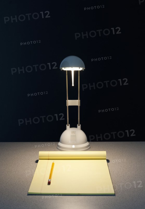 Light and pad of paper.