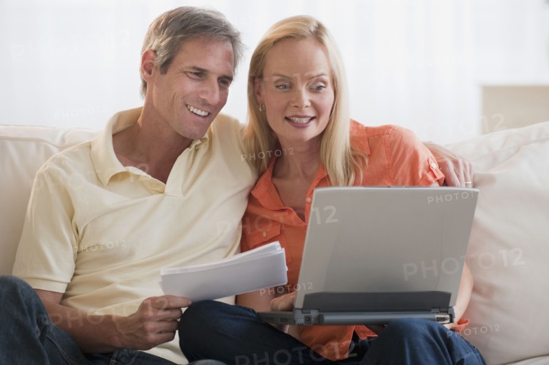 Married couple working on computer.