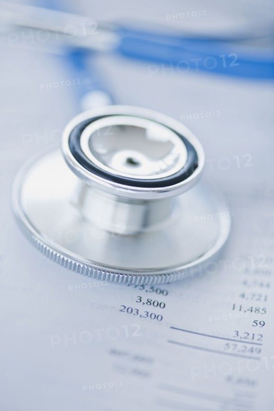 Stethoscope on finance papers.